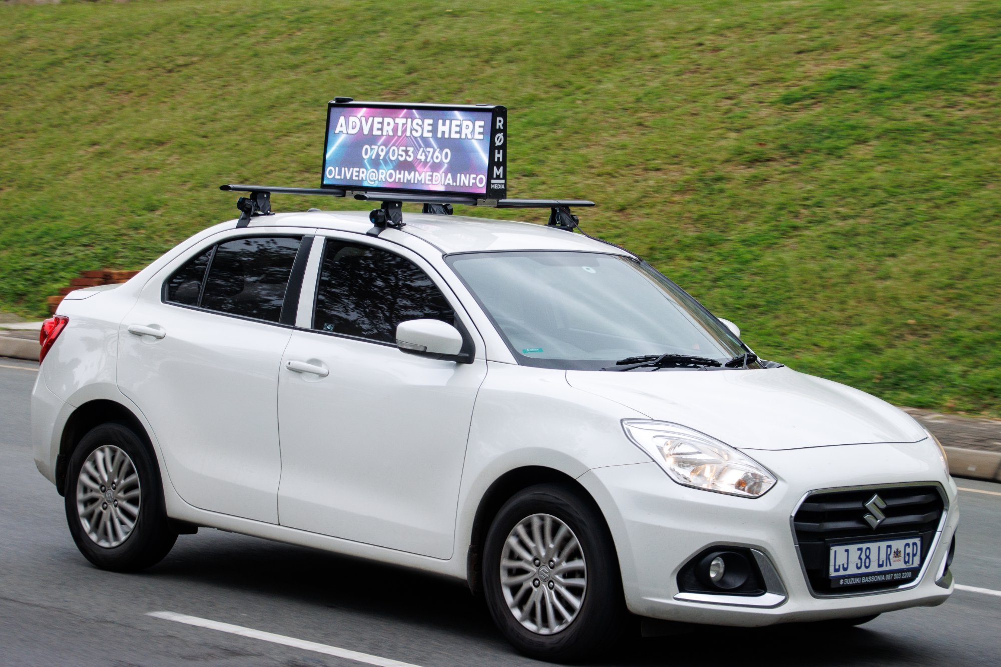 ROHM Media cartop digital billboard on Suzuki Dzire in Johannesburg